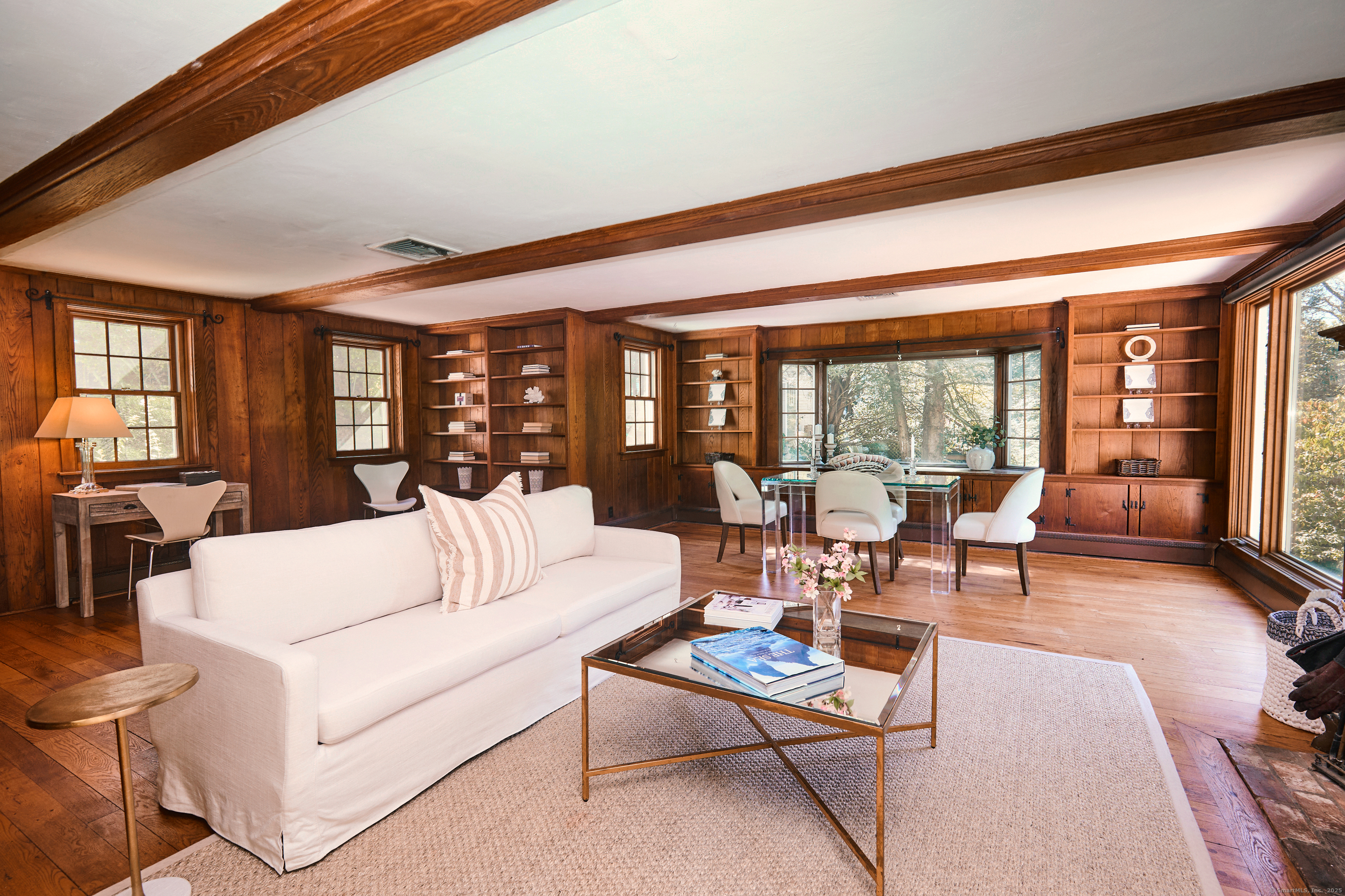 136 Lyons Plain Road Weston, CT 06883 - Photo 9 of 31 a living room with furniture and a large window