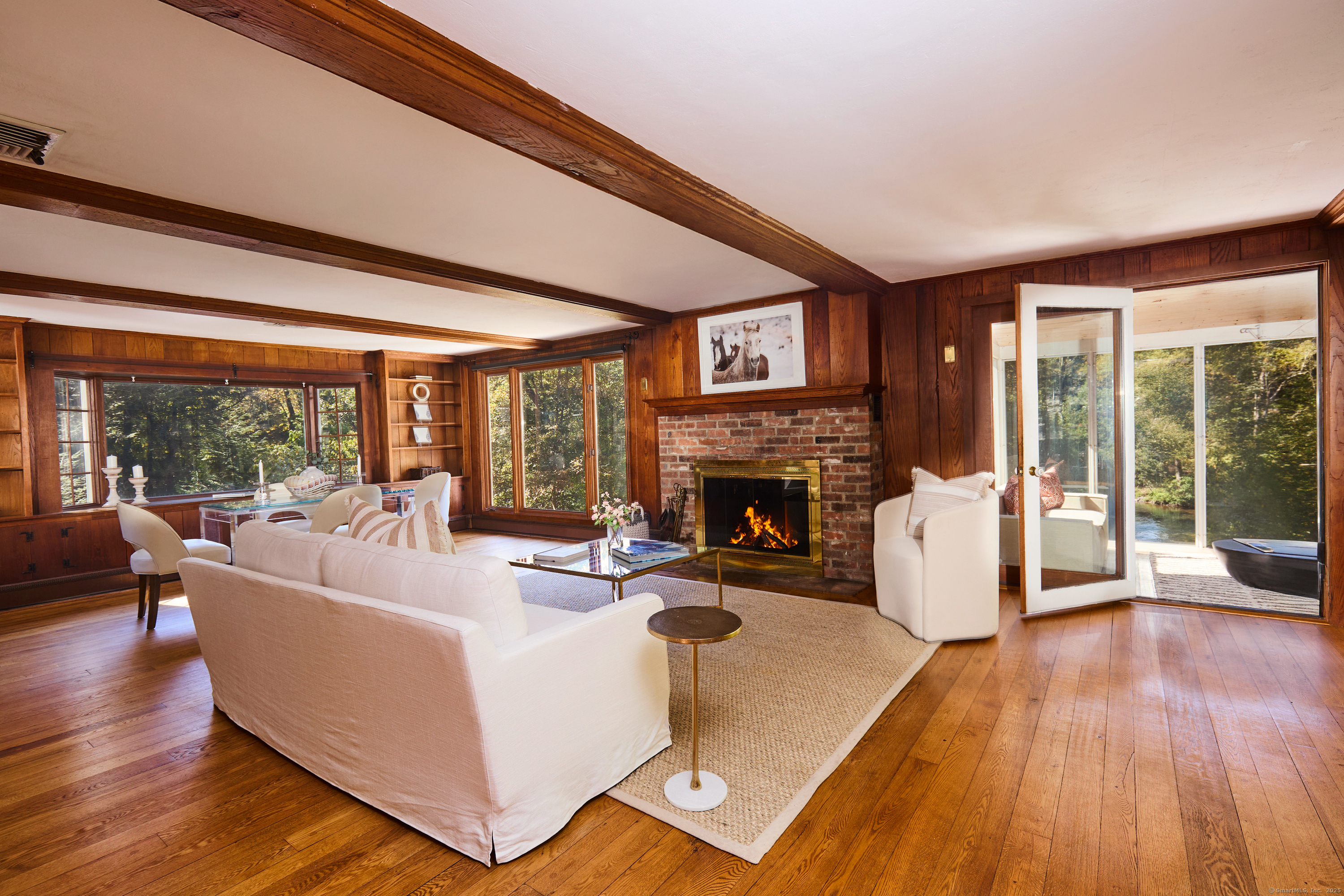 136 Lyons Plain Road Weston, CT 06883 - Photo 10 of 31 a living room with furniture and a fireplace