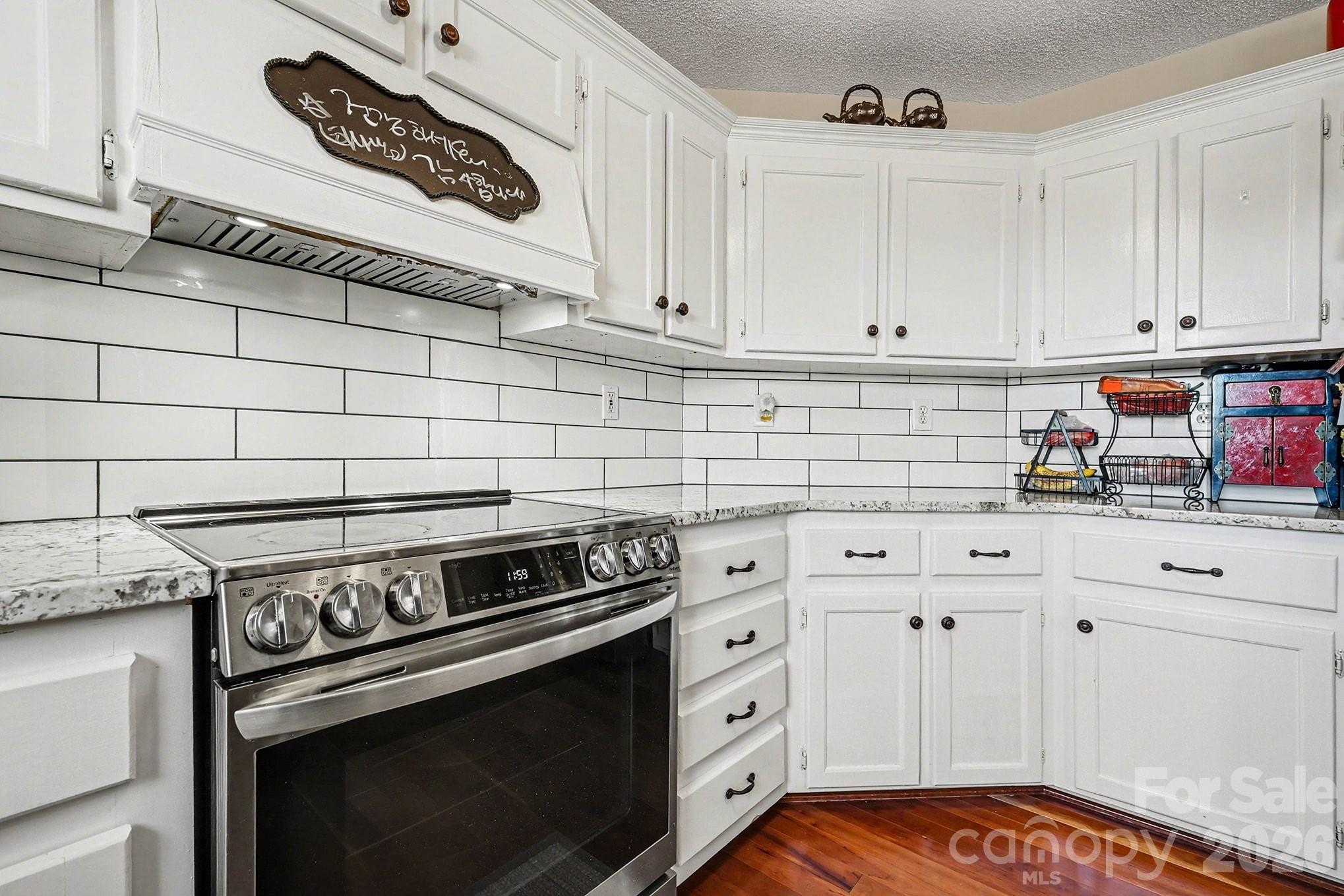 205 John Cline Road Cherryville, NC 28021 - Photo 11 of 41 a kitchen with granite countertop a stove sink and cabinets