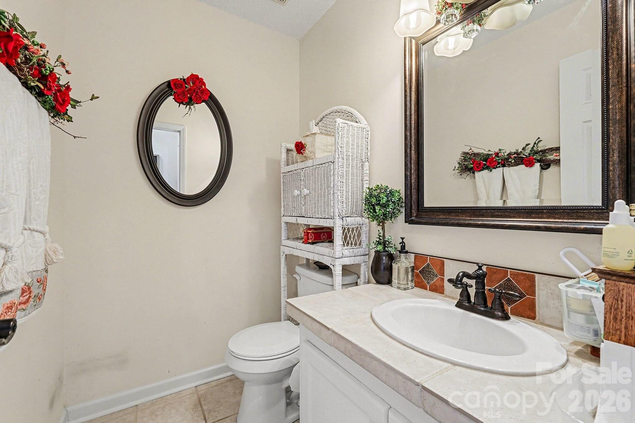 205 John Cline Road Cherryville, NC 28021 - Photo 13 of 41 a bathroom with a toilet a sink and a mirror