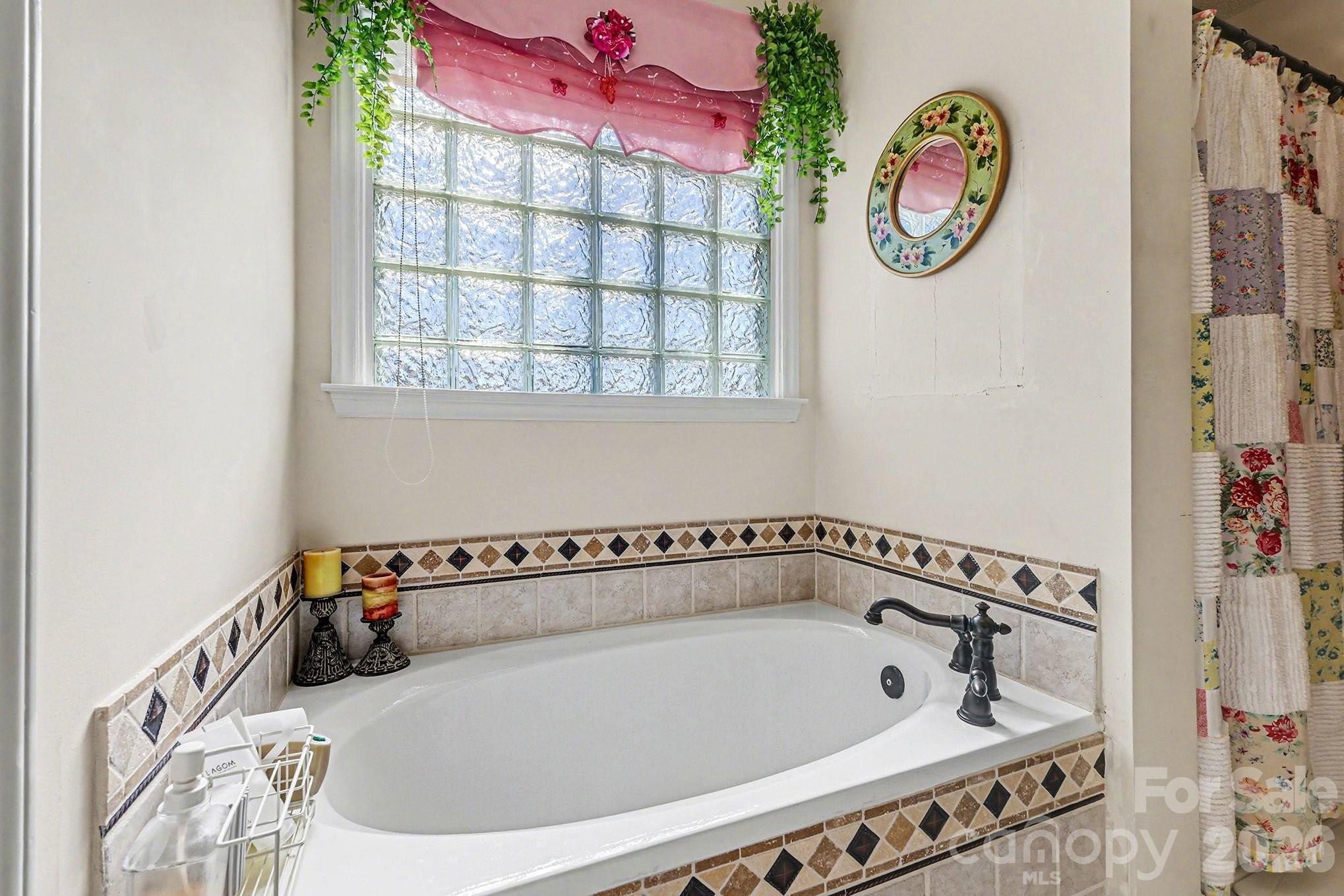 205 John Cline Road Cherryville, NC 28021 - Photo 17 of 41 a bathroom with a bathtub and a window