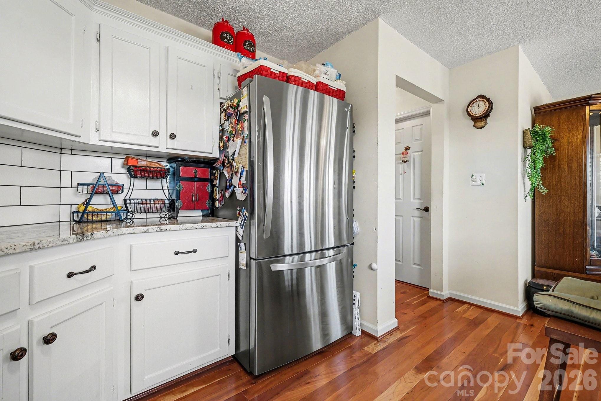205 John Cline Road Cherryville, NC 28021 - Photo 25 of 41 a kitchen with white cabinets and stainless steel appliances