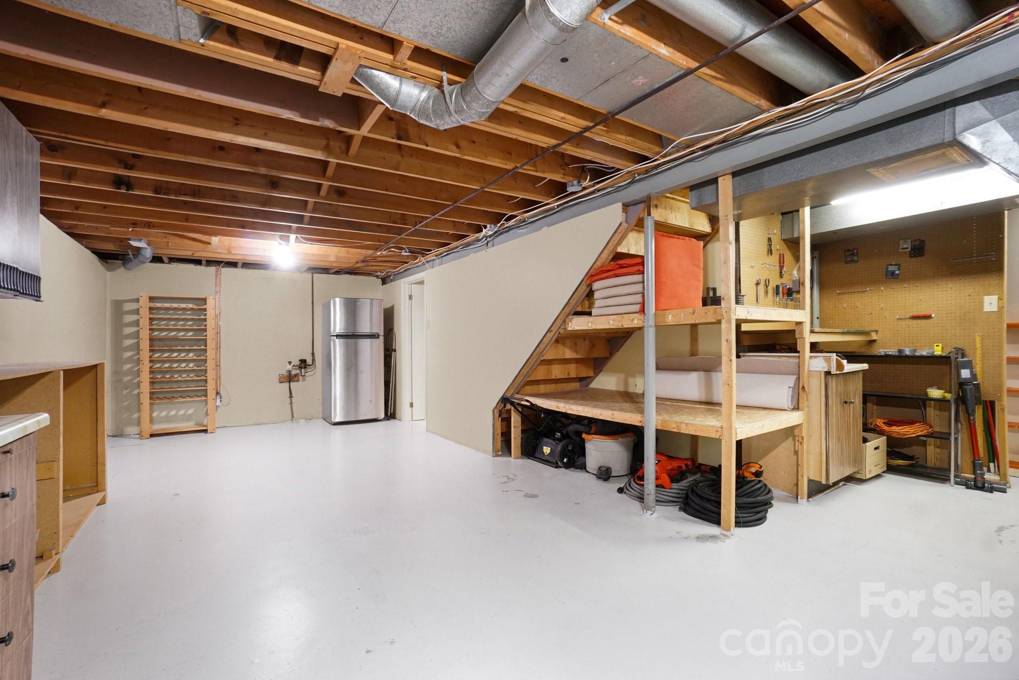 205 John Cline Road Cherryville, NC 28021 - Photo 31 of 41 a view of an empty room with wooden stairs and furniture