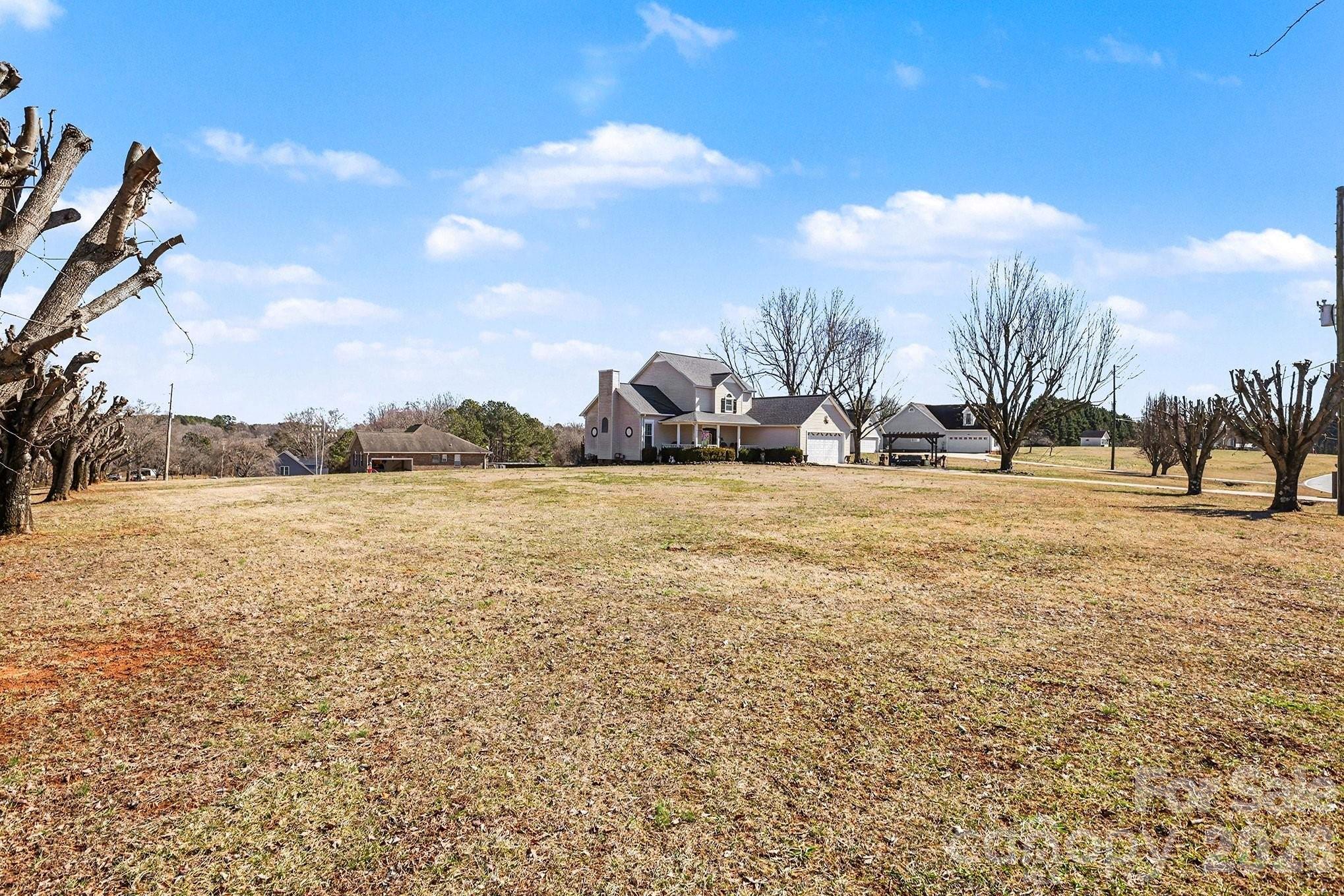 205 John Cline Road Cherryville, NC 28021 - Photo 39 of 41 a view of a lake with houses in the background