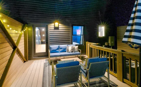a view of a chairs and table in the balcony