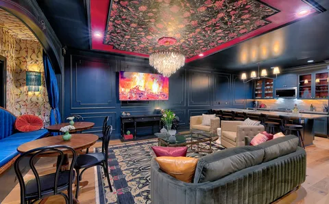 a living room with fireplace furniture and a flat screen tv