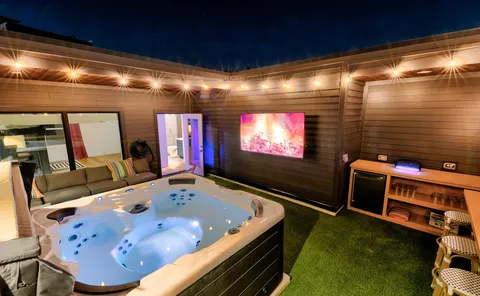 a room with furniture and a flat screen tv