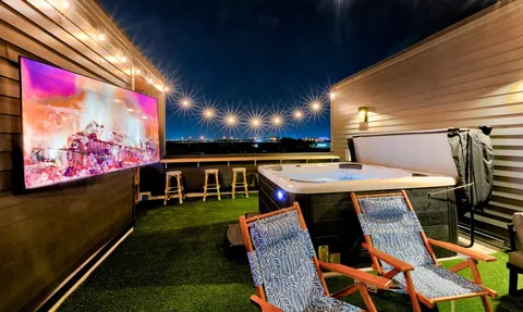 a view of a chairs and table in a patio