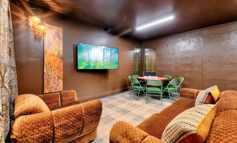 a living room with furniture and a flat screen tv