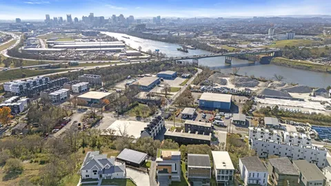 an aerial view of residential houses with outdoor space