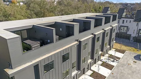 a view of a building with a yard