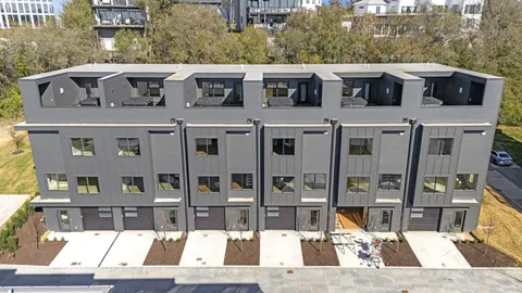 an aerial view of a house with yard swimming pool and outdoor seating