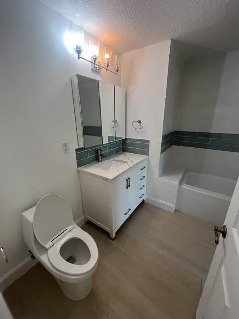1155 Main Street, Unit 209 Jupiter, FL 33458 - Photo 9 of 10 a bathroom with a toilet sink and mirror