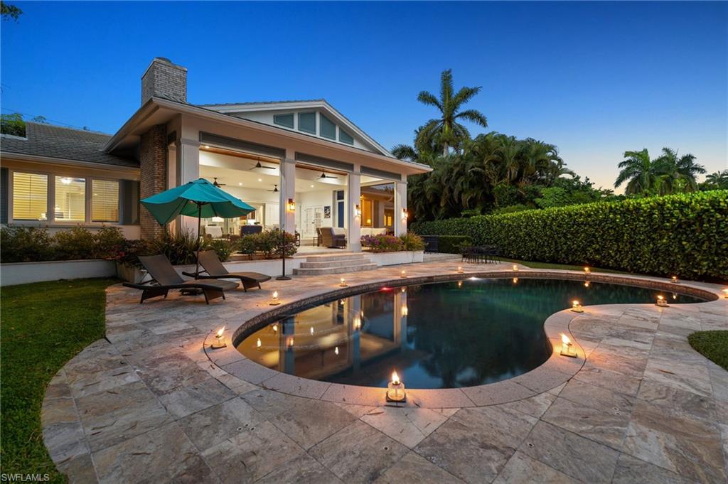 2201 Beacon Lane Naples, FL 34103 - Photo 24 of 25 a view of a house with swimming pool and sitting area