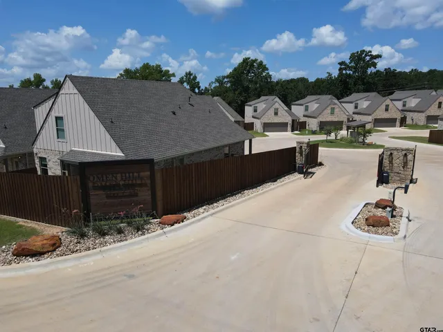 a view of a terrace with furniture and a fire pit