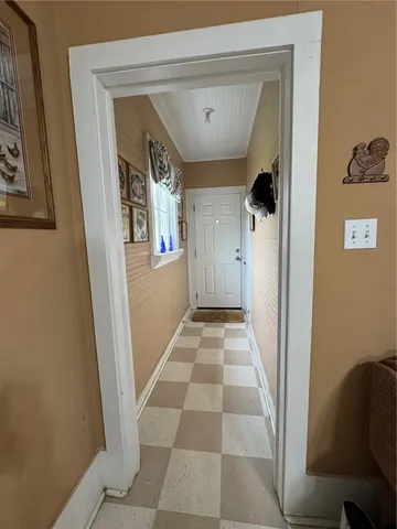a view of a hallway with a black and white walls