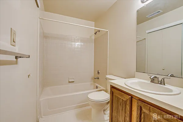 a bathroom with a sink a toilet and a bathtub