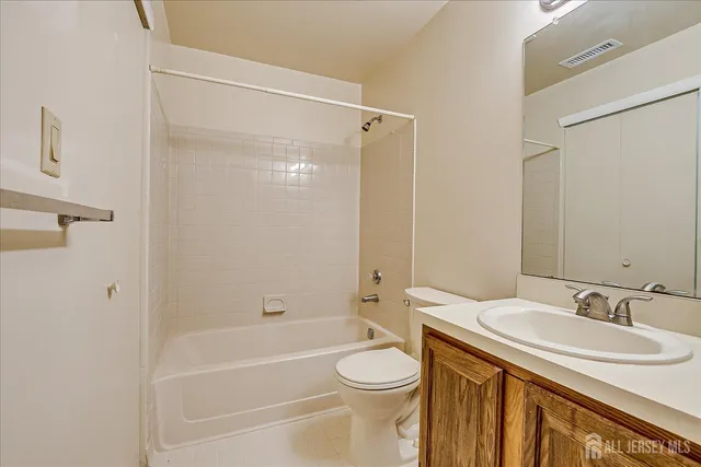 a bathroom with a sink a toilet and a bathtub