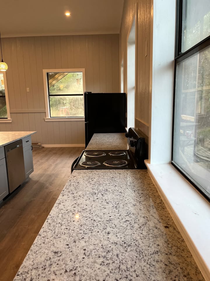 3505 Lone Man Mountain Road, Unit A Wimberley, TX 78676 - Photo 3 of 11 Functional kitchen with ample counter space and well-lit interiors.