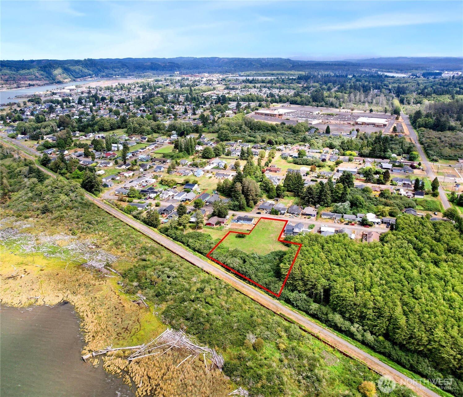 -xxx Calhoun Road Aberdeen, WA 98520 - Photo 8 of 14 an aerial view of residential houses with outdoor space and trees
