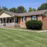 a front view of a house with yard