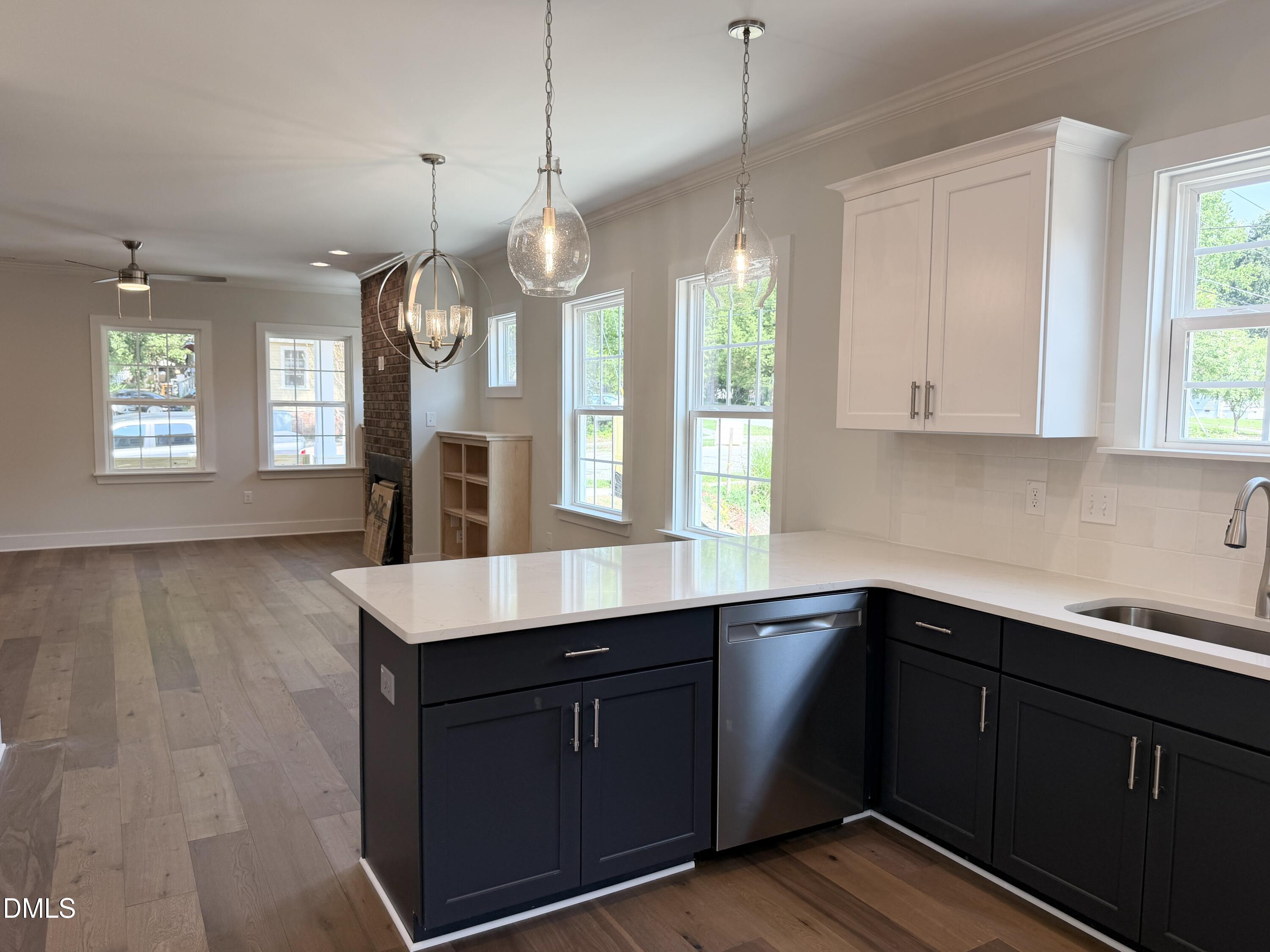1122 Berkeley Street Durham, NC 27705 - Photo 10 of 29 a kitchen with a sink window and cabinets