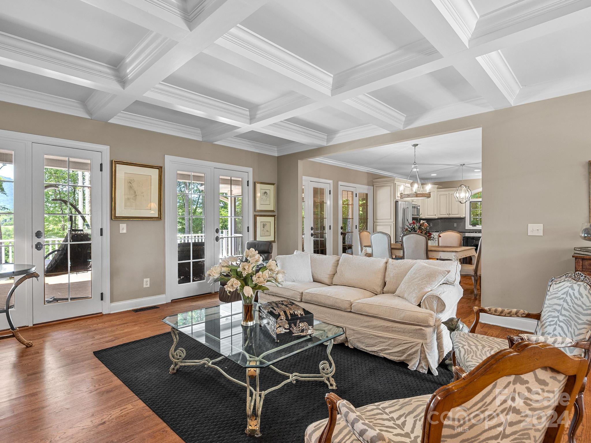 699 Bill Collins Road Columbus, NC 28722 - Photo 8 of 38 a living room with furniture a wooden floor and a large window
