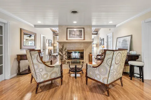 a bedroom with a bed and a ceiling fan