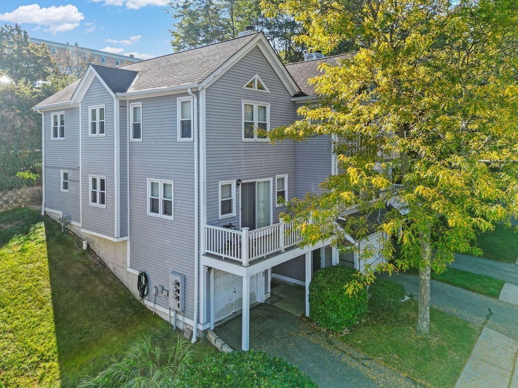 1810 Highland Avenue, Unit 22 Fall River, MA 02720 - Photo 11 of 33 a front view of a house with a yard