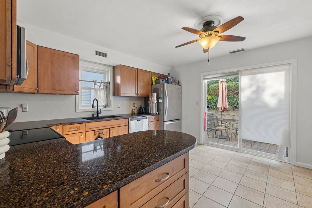 1810 Highland Avenue, Unit 22 Fall River, MA 02720 - Photo 15 of 33 a kitchen with stainless steel appliances granite countertop a sink a stove counter space and cabinets