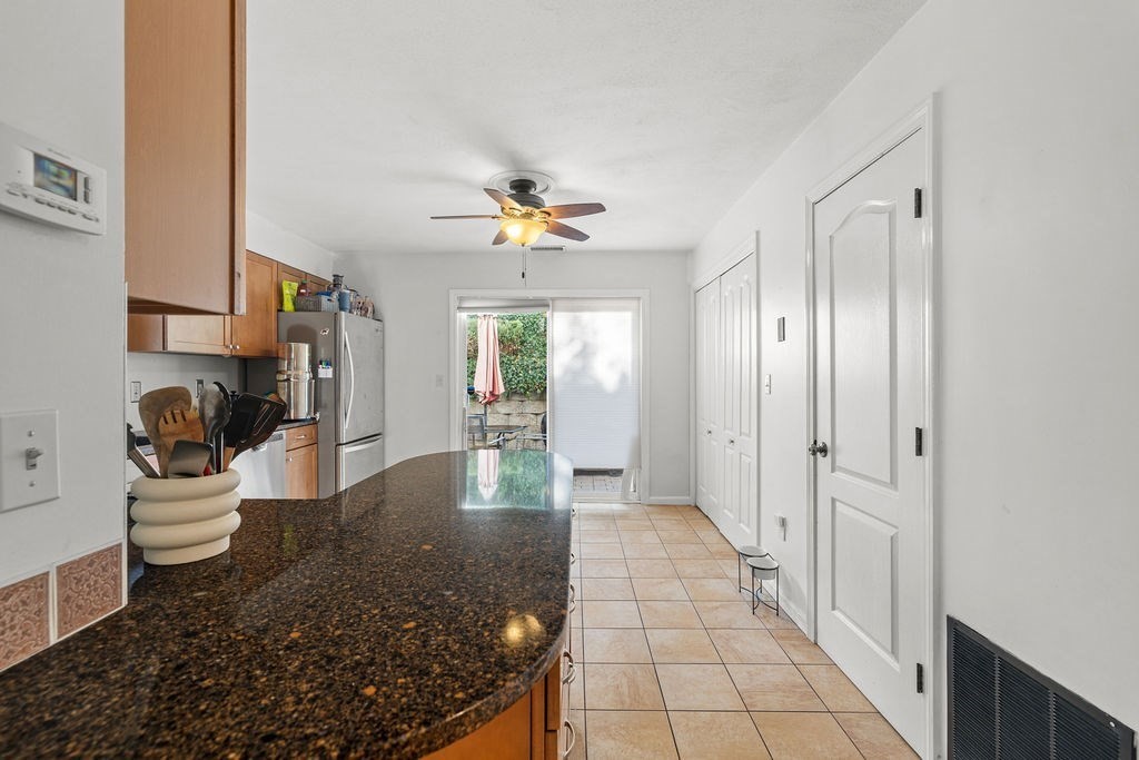 1810 Highland Avenue, Unit 22 Fall River, MA 02720 - Photo 16 of 33 a view of a hallway with dining area and chandelier