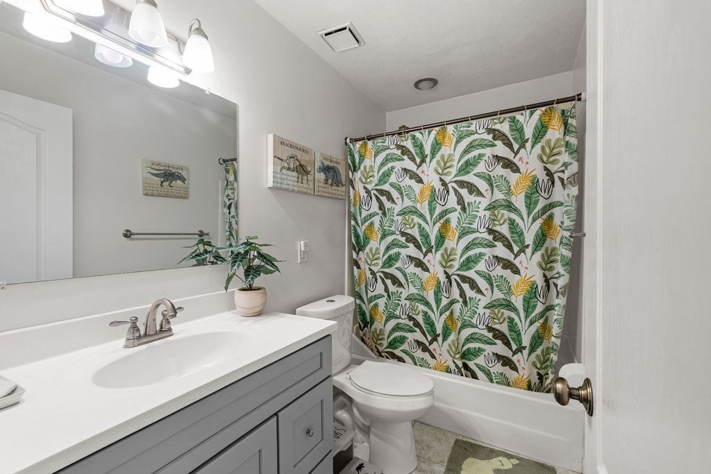 1810 Highland Avenue, Unit 22 Fall River, MA 02720 - Photo 23 of 33 a bathroom with a granite countertop sink a toilet and a mirror