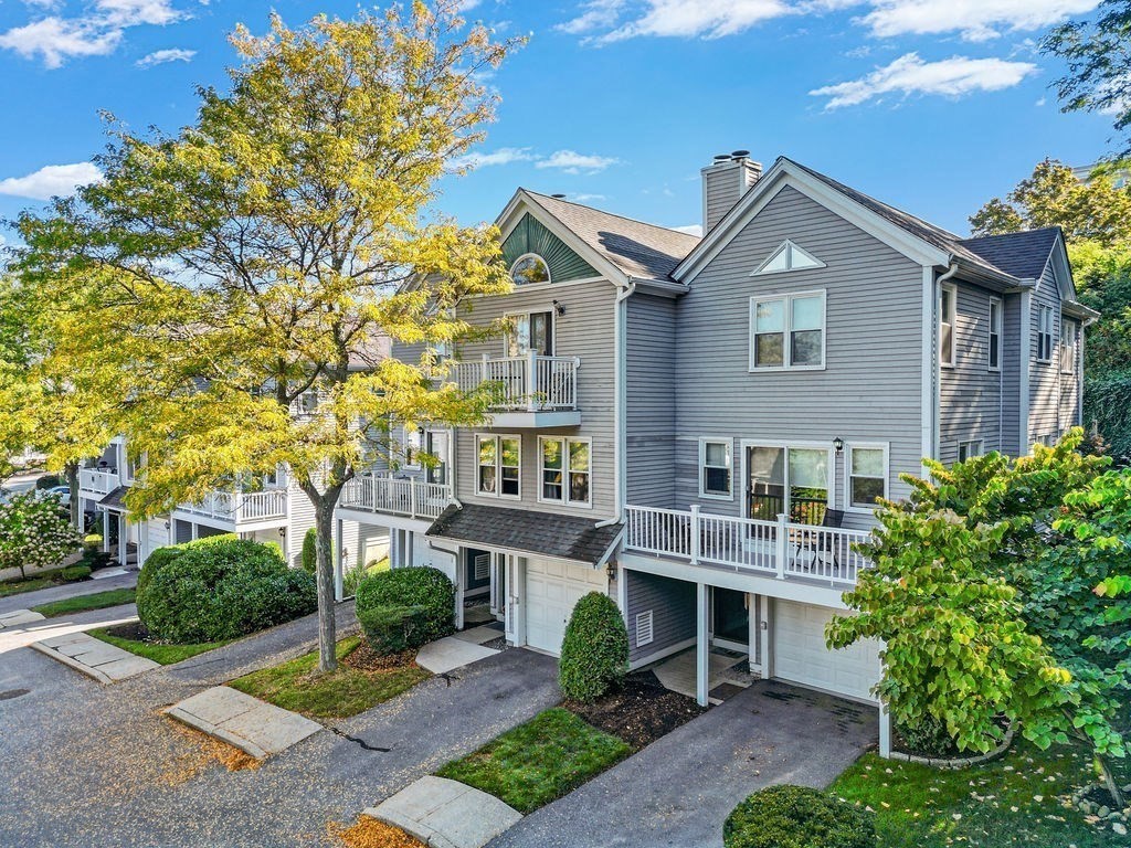 1810 Highland Avenue, Unit 22 Fall River, MA 02720 - Photo 7 of 33 a front view of a house with a garden