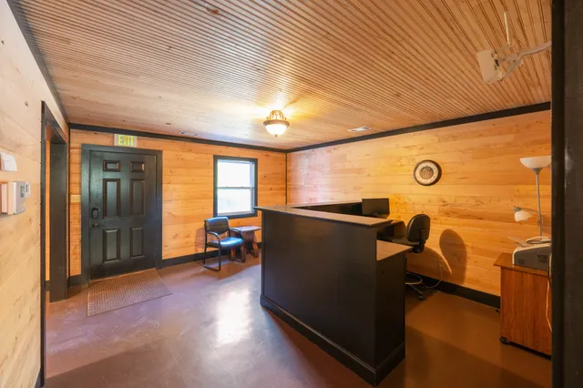 a view of front door with wooden floor