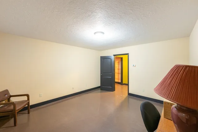 a room with furniture and air conditioner vent