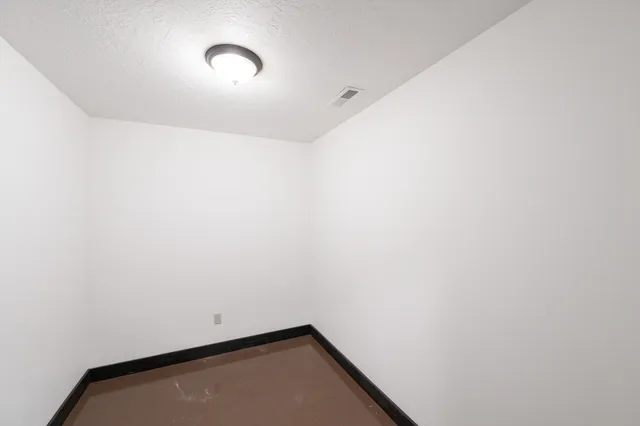 a view of a living room with hardwood floor