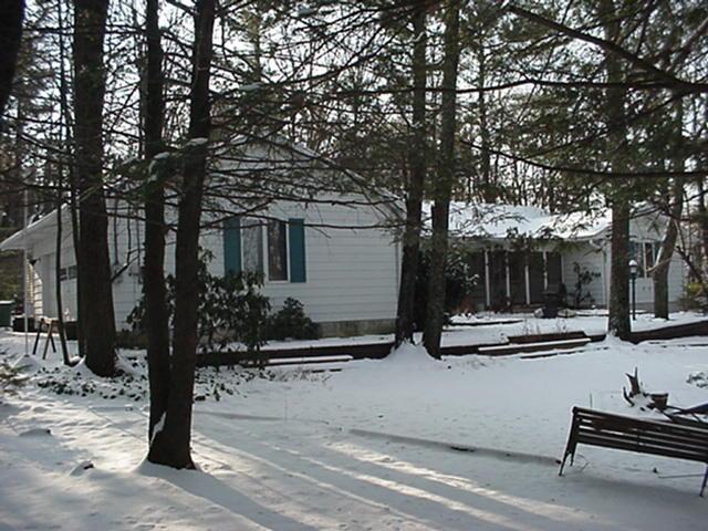 306 Gernerd Road Effort, PA 18330 - Photo 1 of 4 a backyard of a house with barbeque oven and outdoor seating