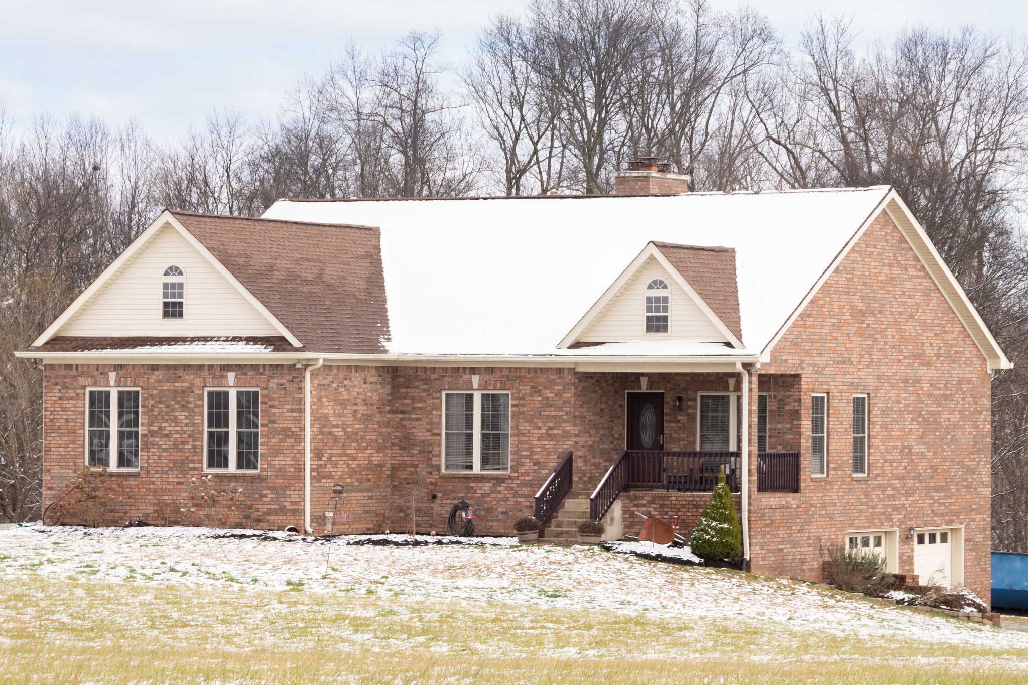 4945 Charles Dorris Road Springfield, TN 37172 - Photo 1 of 41 a front view of a house with a yard covered in snow
