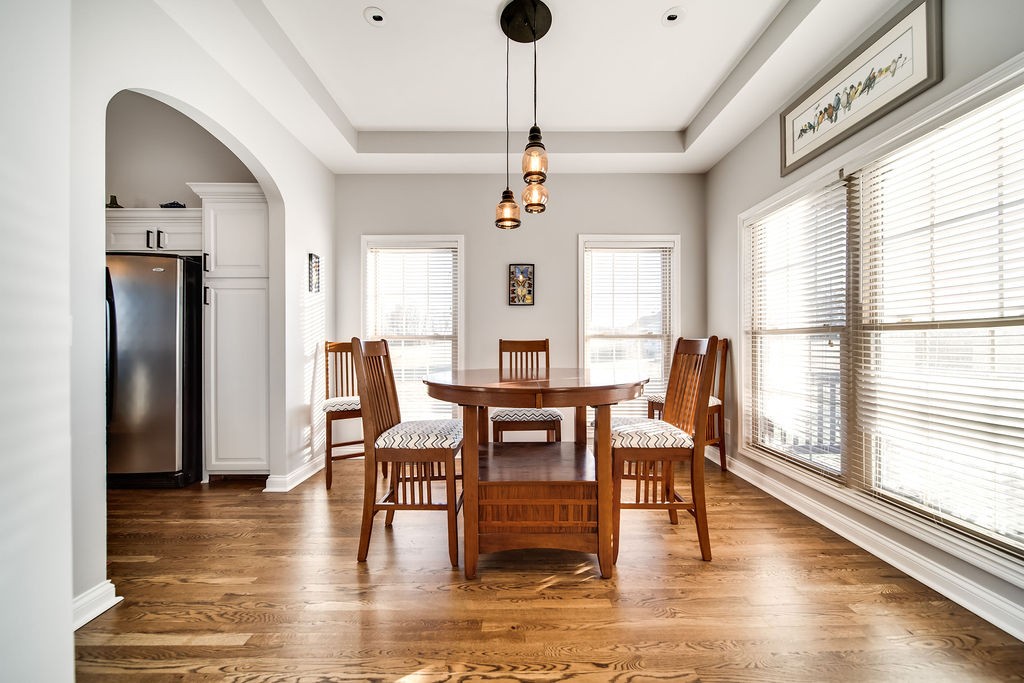 4945 Charles Dorris Road Springfield, TN 37172 - Photo 11 of 41 a dining room with furniture a window and wooden floor
