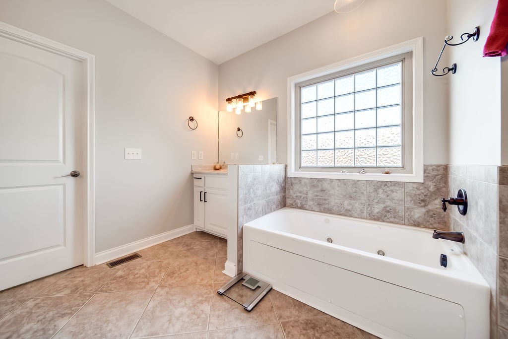4945 Charles Dorris Road Springfield, TN 37172 - Photo 27 of 41 a white bath tub sitting next to a window