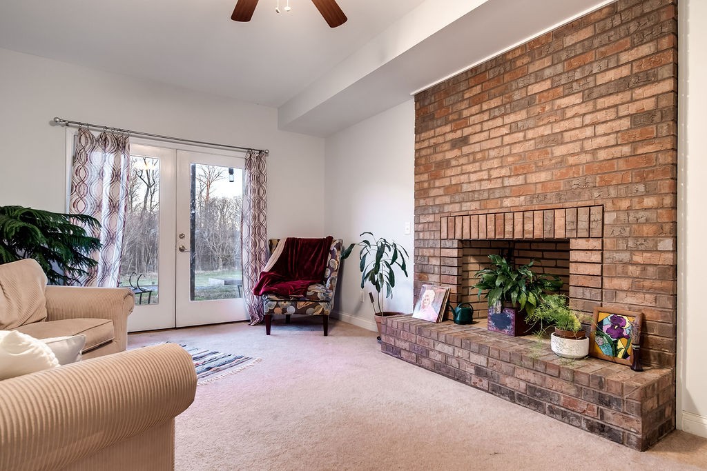 4945 Charles Dorris Road Springfield, TN 37172 - Photo 31 of 41 a living room with furniture and a fireplace