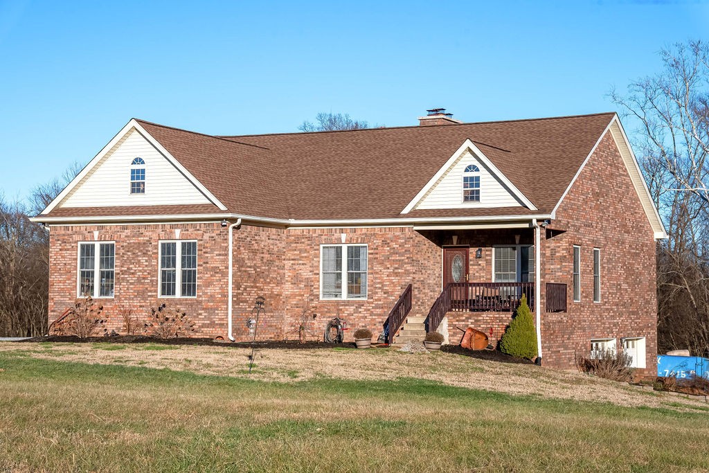 4945 Charles Dorris Road Springfield, TN 37172 - Photo 9 of 41 a view of a white house with large windows next to a road