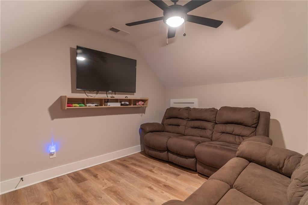 2250 Sperin Road Ball Ground, GA 30107 - Photo 42 of 56 a living room with furniture and a flat screen tv