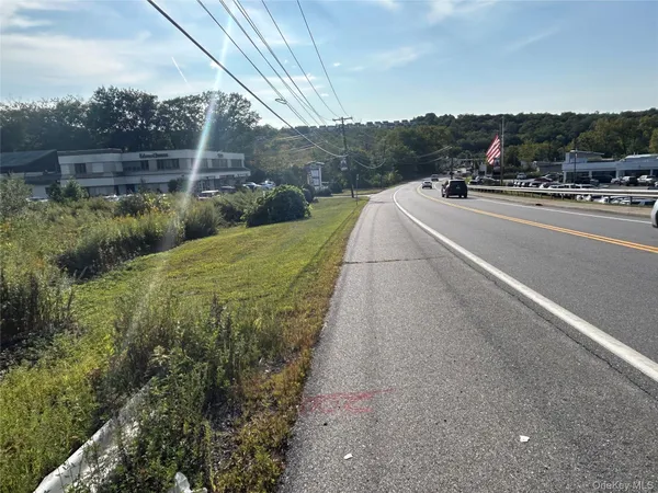 a view of a road with a yard