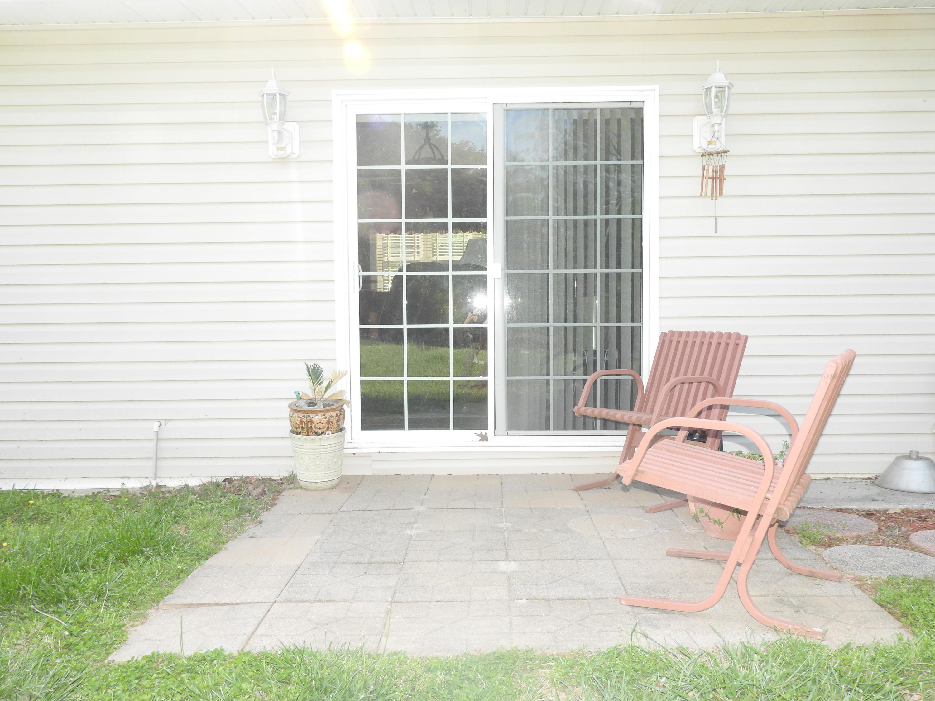 2370 Morgans Mill Road Goodview, VA 24095 - Photo 22 of 24 a view of chair and fire pit in backyard