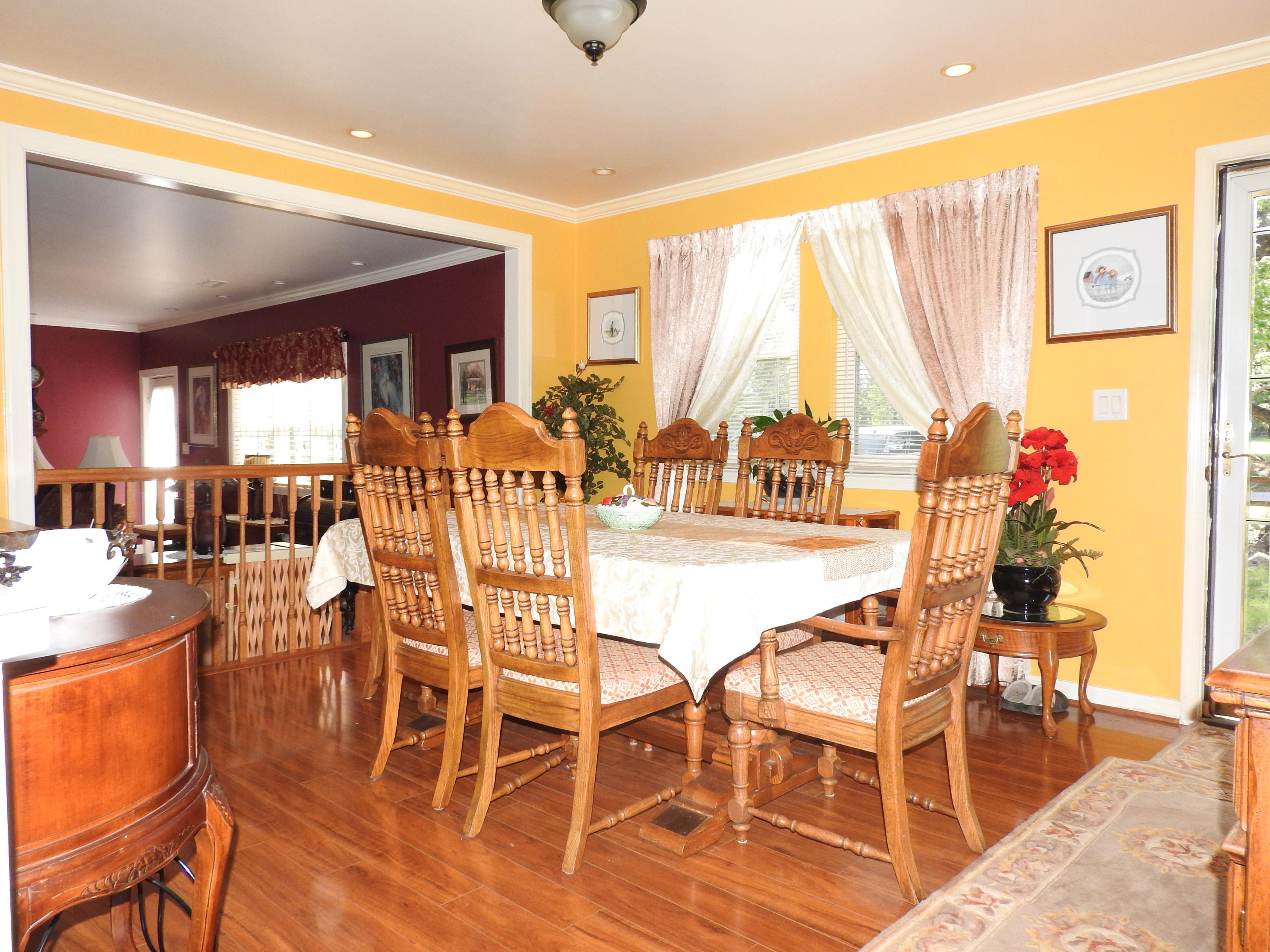 2370 Morgans Mill Road Goodview, VA 24095 - Photo 4 of 24 a view of a dining room with furniture and wooden floor