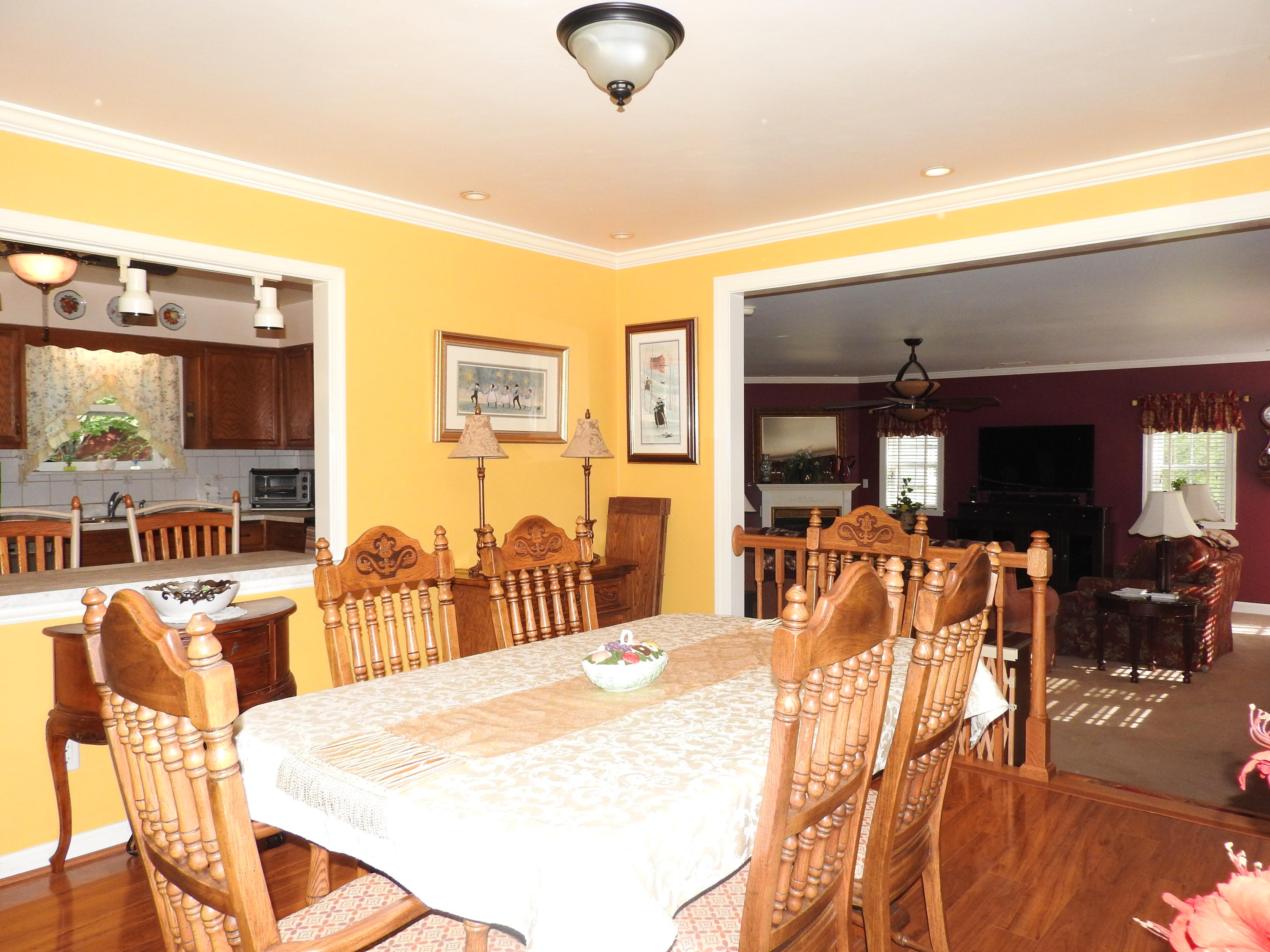 2370 Morgans Mill Road Goodview, VA 24095 - Photo 5 of 24 a view of a dining room with furniture and wooden floor