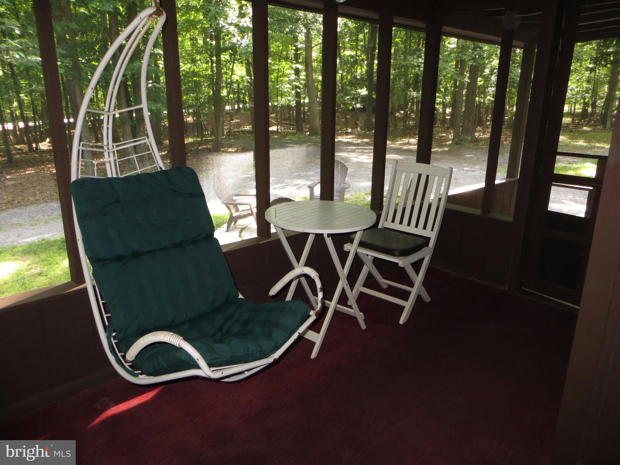 89 Ruffed Grouse Lane Hedgesville, WV 25427 - Photo 19 of 26 Screened in Porch at Entry