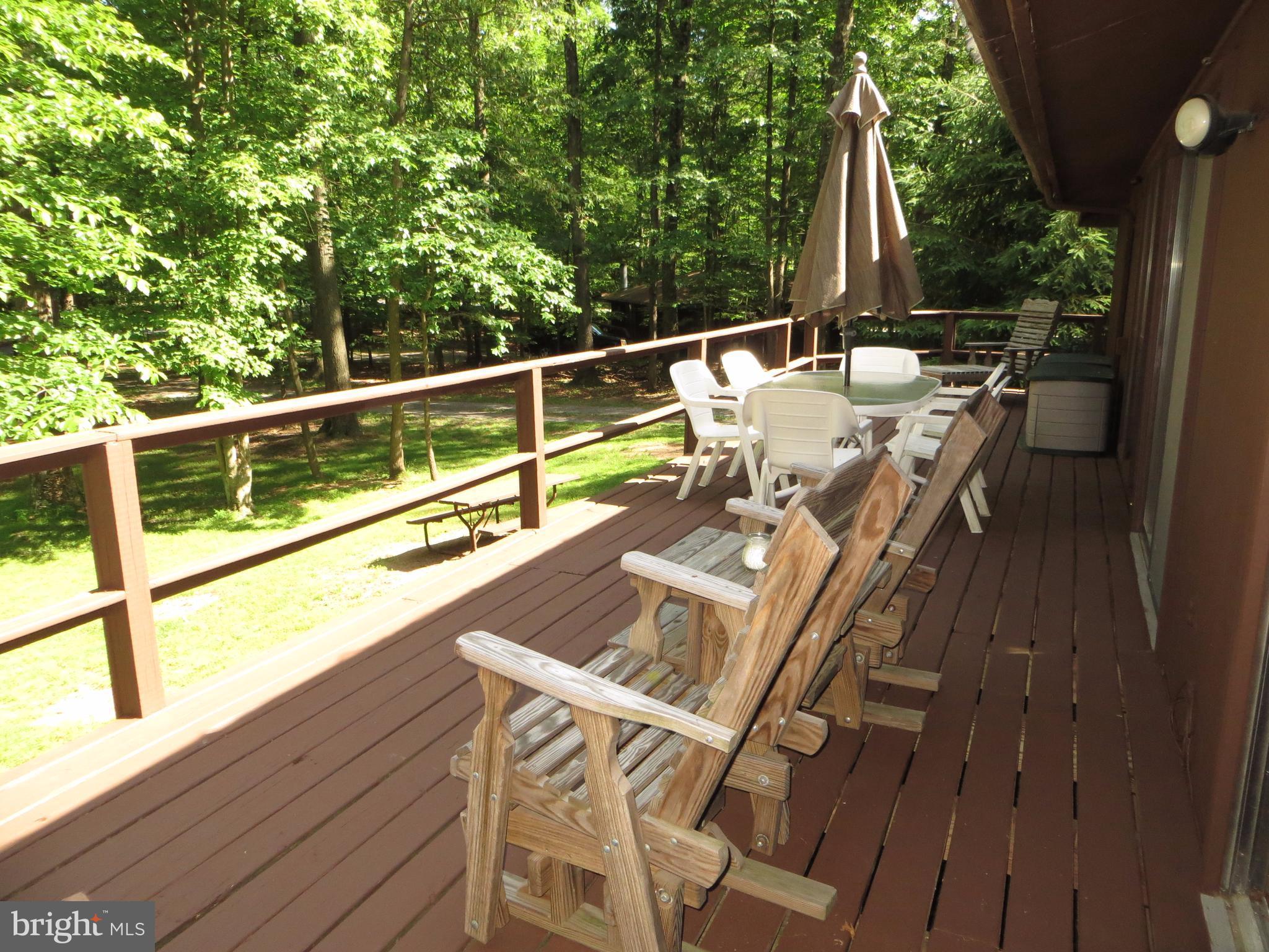 89 Ruffed Grouse Lane Hedgesville, WV 25427 - Photo 21 of 26 Large Open Deck w/View of Wooded Lot
