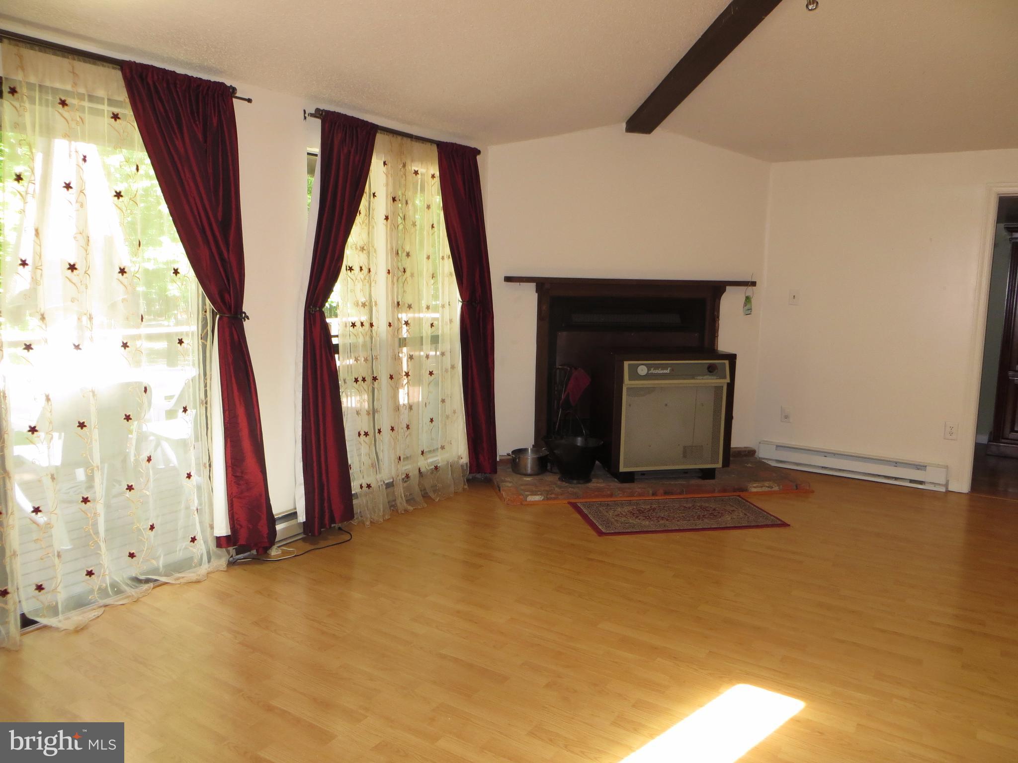 89 Ruffed Grouse Lane Hedgesville, WV 25427 - Photo 7 of 26 Great Room w/Heartwood Wood Stove